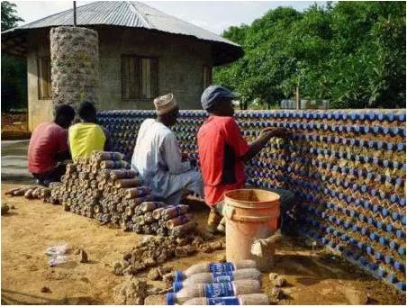 Men Build Houses With An Empty Plastic Bottles