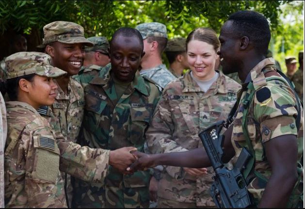 US Soldiers Enjoy Python Meat In Ghana(PHOTOS)