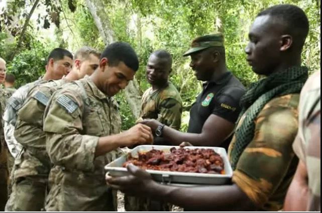 US Soldiers Enjoy Python Meat In Ghana(PHOTOS)