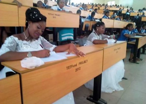 Two students of Benue State University in Nigeria write final exams in their wedding gowns (Photos)