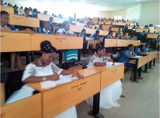 Two students of Benue State University in Nigeria write final exams in their wedding gowns (Photos)