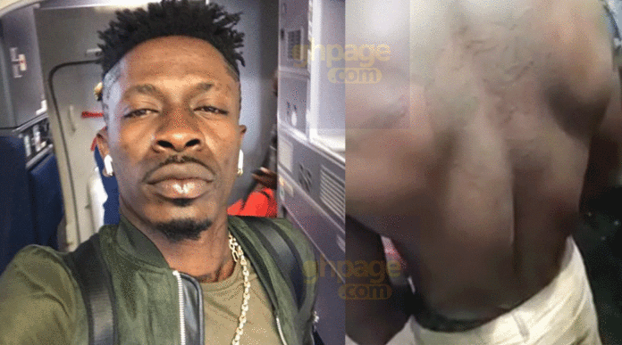 Another SM fan tattoo Shatta Wale's face on his back