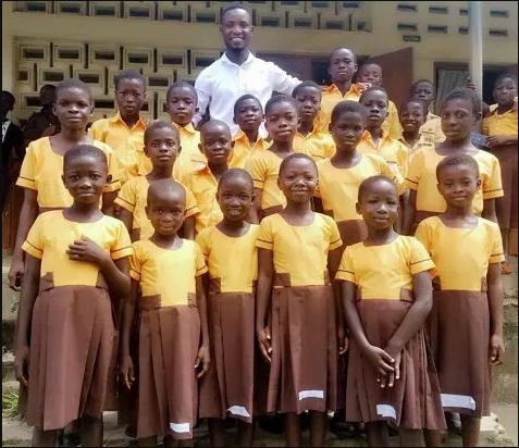 Teacher Kwadwo sews school uniforms for pupils with his monthly salary
