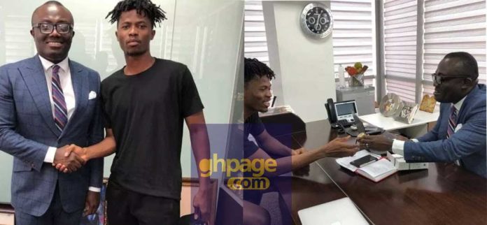 Kwesi Arthur receives an expensive wrist watch from Bola Ray