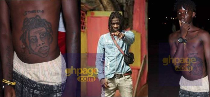 Fan tattoo Stonebwoy's face on his stomach