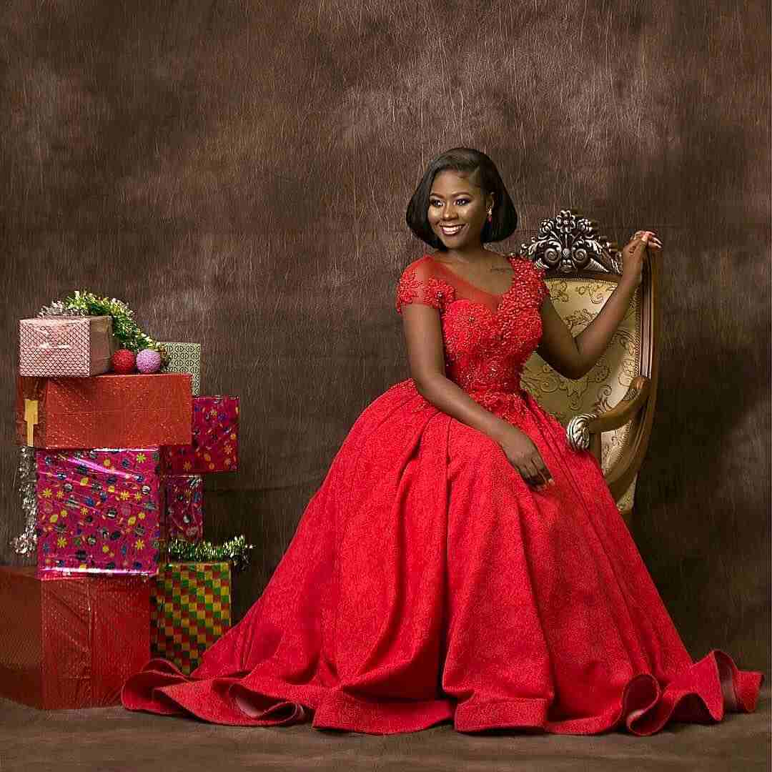Salma Mumin posing with package Christmas gifts