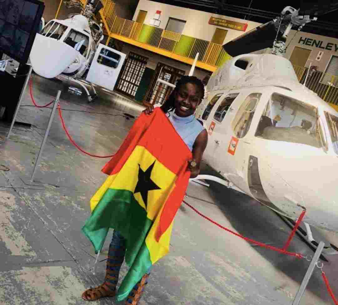 Pilot Maame Esi posing with Ghana flag
