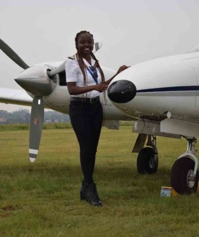 Pilot posing with aircraft 