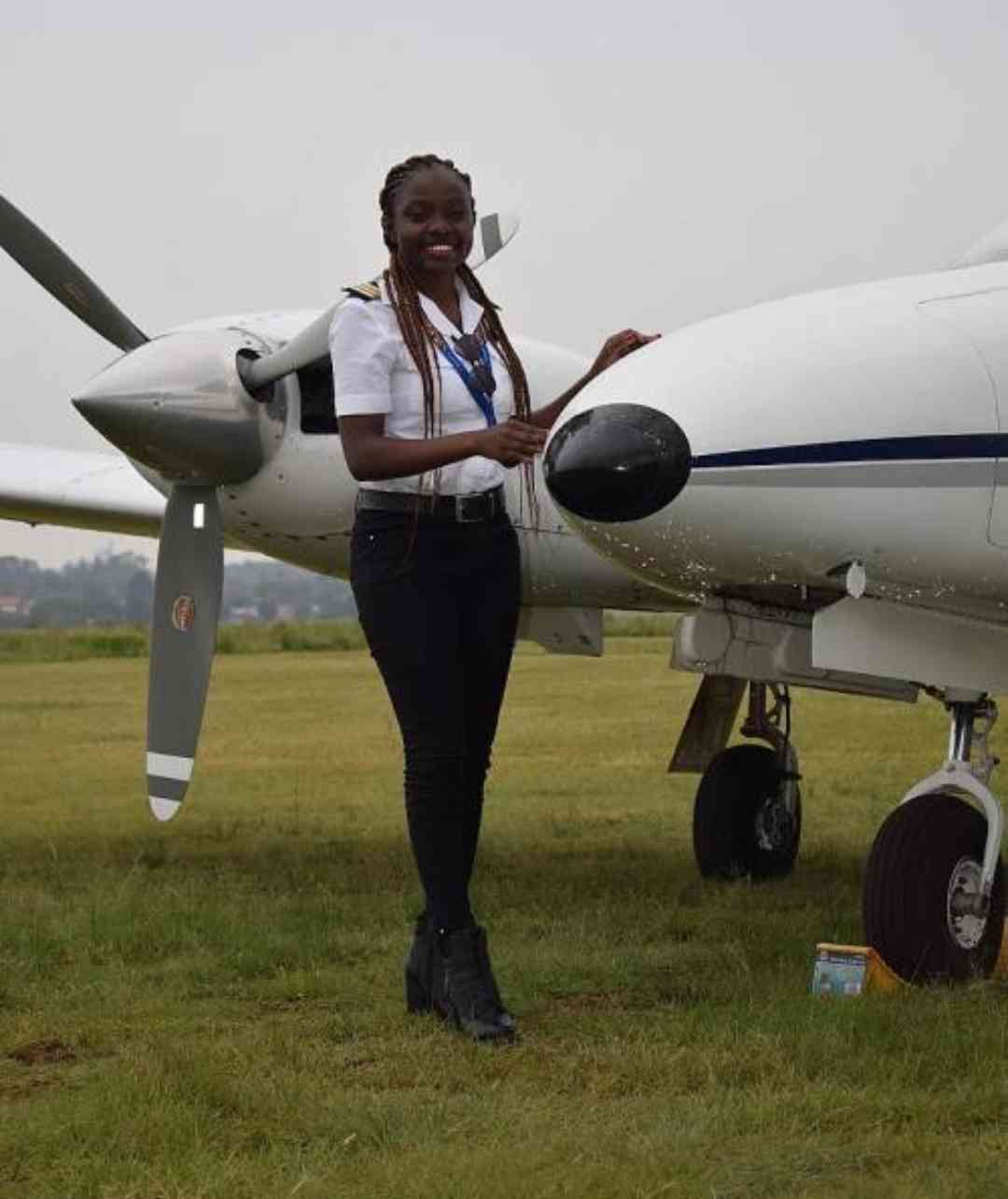 Pilot posing with aircraft