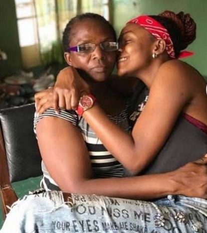 Simi sitting on her mother's lap