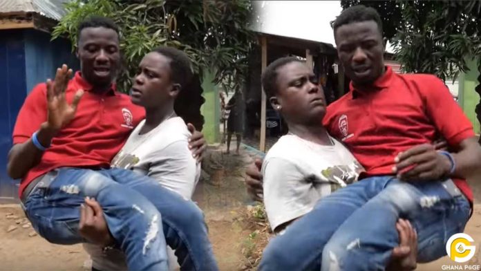 Kwaku-Manu-ghetto Ghetto Queen carries Kwaku Manu like a baby in an aggressive interview