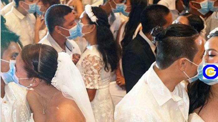 220-couples-kiss-while-wearing-face-masks-at-mass-wedding-amid-Coronavirus-scare