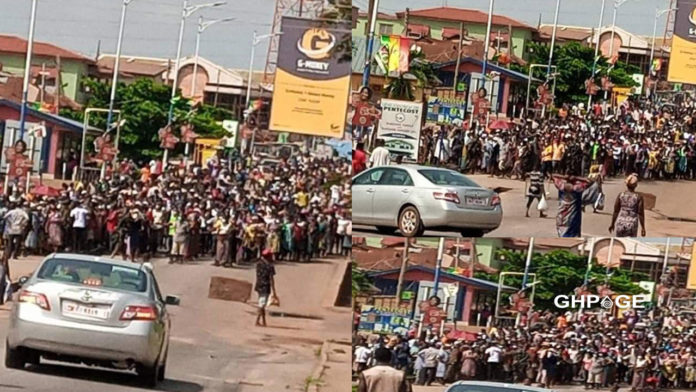 Residents defy social distancing rules as they queue to receive food from NADMO