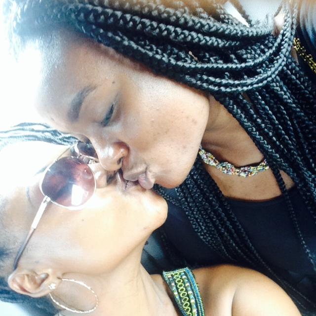 Anell and Moira Araba Dawson kissing