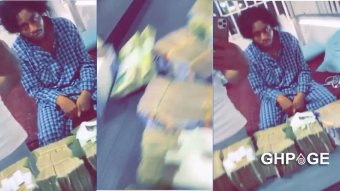 Young man flaunts the stacks of cash packed in his room on social media