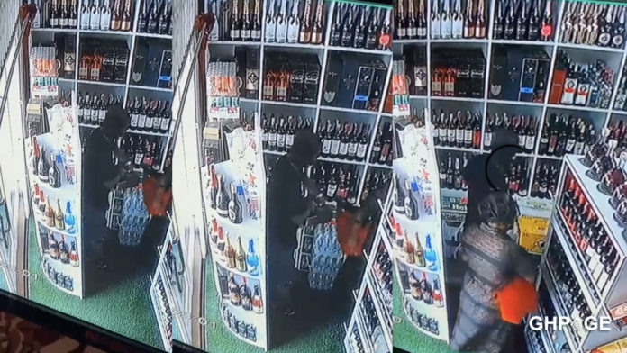 CCTV footage captures mother and son shop-lifting in a wine shop
