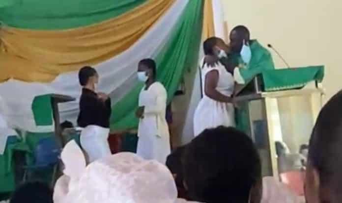 Anglican Priest kissing female students of St Monica’s College of Education