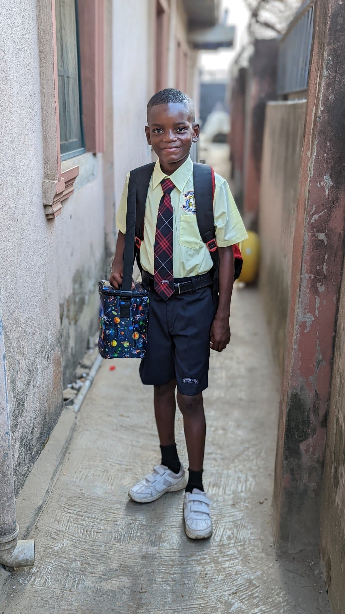 Kind man transforms life of poor kid he saw collecting scraps, enrols him in school [Photos]