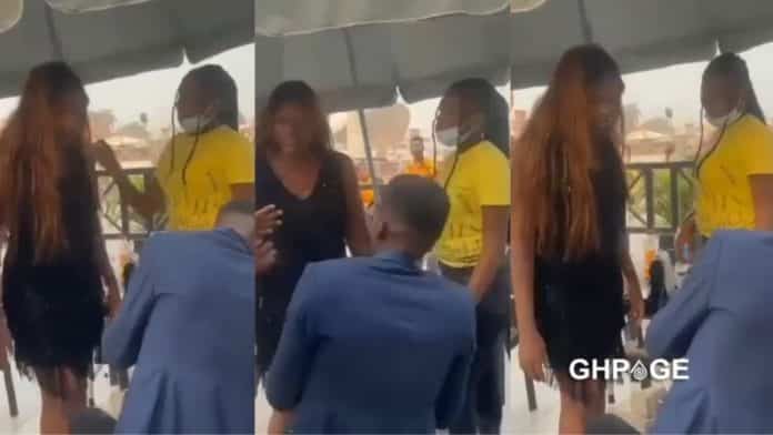 Lady gives her boyfriend two hot slaps & smashes his head with cake for proposing to her in public (Video)