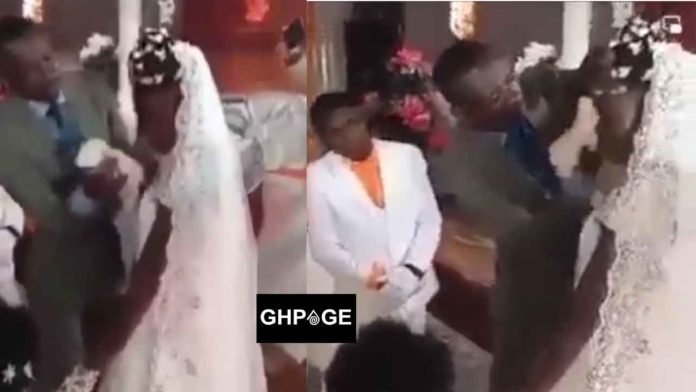 Pastor cleaning off bride's makeup