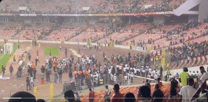 Ghanaian supporters flee for safety following attack from angry Nigerian supporters