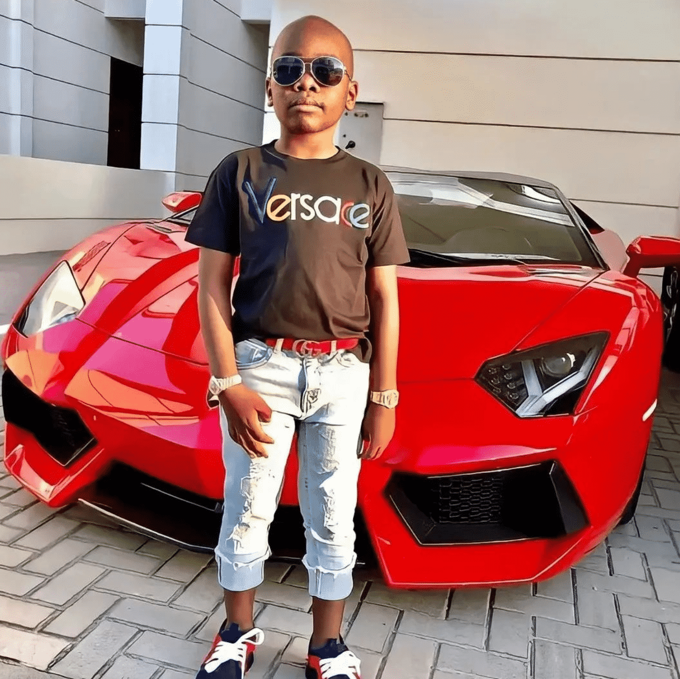 See photos of the world's youngest millionaire who has cars, houses, and a private jet