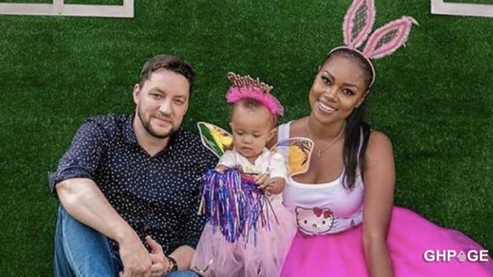 Yvonne Nelson with daughter and baby daddy