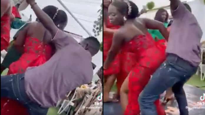 Photographer loses focus at wedding; steals show with wild moves