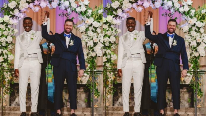 African man shares his wedding photos with a white guy; Social media users react