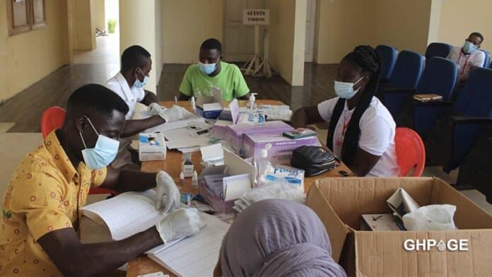 Health workers around a table