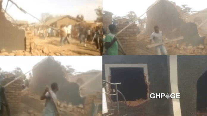 Man demolishes houses he built for his wife and her mother after she dumped him for another man (video)