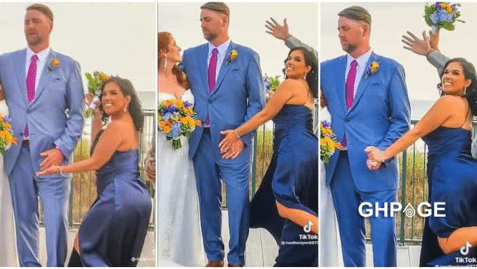 Bridesmaid touches groom in his man area during photoshoot