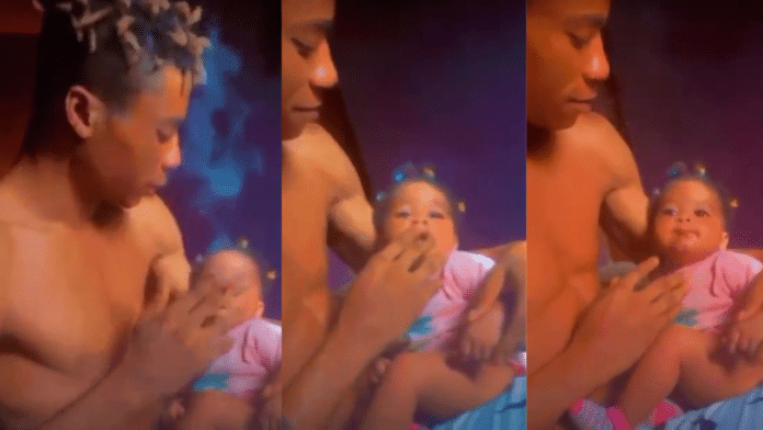 Video of a father smoking with his 6-months old daughter goes viral