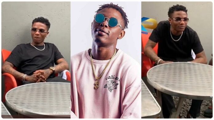 Wizkid sits on plastic chair at GH funeral, Nigerians fume