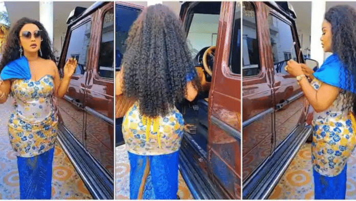 Nana Ama Mcbrown rocks a stylish dress as she flaunts her expensive G-Wagon