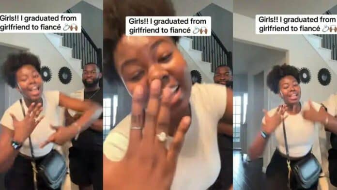 Beautiful lady happily celebrates as she graduates from girlfriend to fiancée