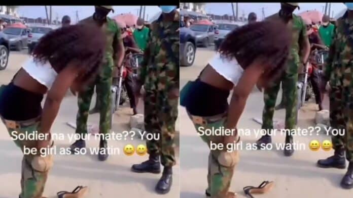 VIDEO Moment soldiers made lady wearing a camouflage to publicy undress leaving only her underwear