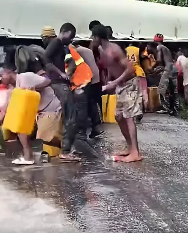 Konongo youths rush to siphon oil from an overturned tanker